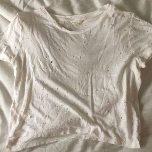 A white t-shirt with little holes in it